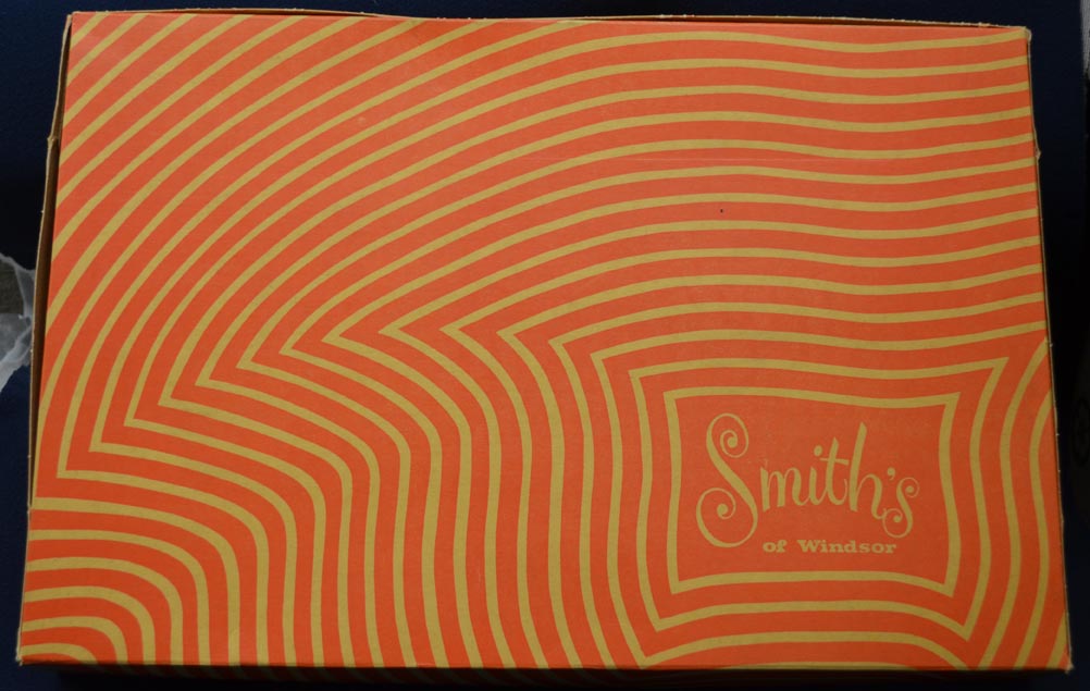 a%20rectangular%2C%20orange%20and%20yellow%20with%20wavy%20pattern%20merchandising%20box%20from%20Smith%27s%20of%20Windsor